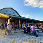 Sun setting behind Caesar Creek Vineyard's barn at Raise a Glass to Reading event