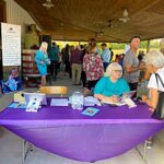 People checking in to Raise a Glass to Reading event