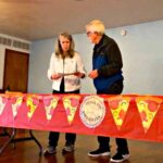 Head librarian sorts through volunteer certificates