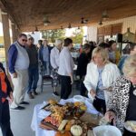 Attendees lineup for food at Raise a Glass to Reading