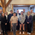 librarians pose with volunteers