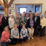 librarians pose with volunteers