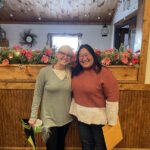 librarian poses with volunteer