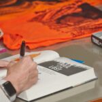 close up of Author Andy Lankford signing book