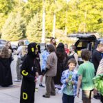 teens gather outside before event opens