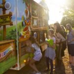teen picks snow cone flavor