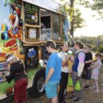 teens in line to get snow cones
