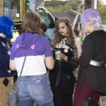 group of teens enjoy snow cones outside