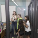 teens sing at the karaoke booth