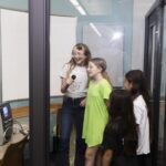 teens sing at the karaoke booth