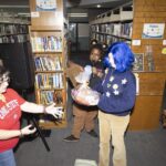 Kim B presents award to costume contest winner Coraline