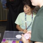 boy makes bracelet