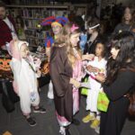 teens in costume converse