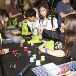teens make friendship bracelets