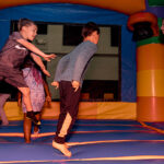 kids jumping in bounce house