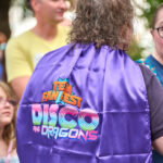 Event staff member in her purple Teen Fan Fest cape