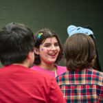 teen with stickers on face