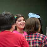 teen with stickers on face