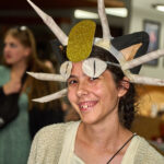 Teen girl dressed as Meowth from Pokemon