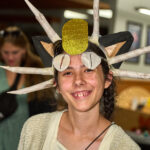 Teen girl dressed as Meowth from Pokemon