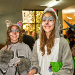 Two teens dressed up as woodland animals smiling