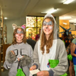 Two teens dressed up as woodland animals smiling