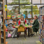 3 teens playing tabletop game
