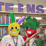 Teens dressed up as fruit with homemade lemon and strawberry masks