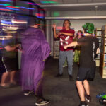 teens dance in silent disco area