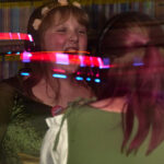 Teen girls sing along during silent disco
