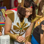teen dressed as She-Ra makes potion craft