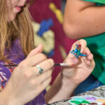 teen paints mini figurine