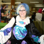teen dressed up smiles