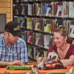 couple writing trivia answers