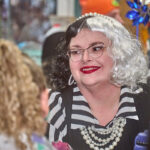 woman in black and white wig smiling