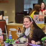 woman dressed as nun smiling