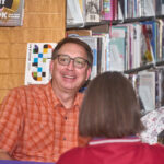 two patrons smiling