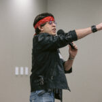 Lead actor as the Rockstar pointing out into the audience