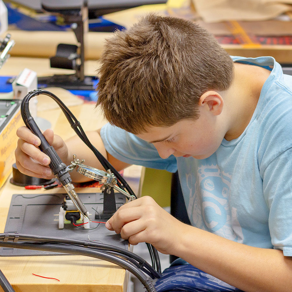 Boy soldering